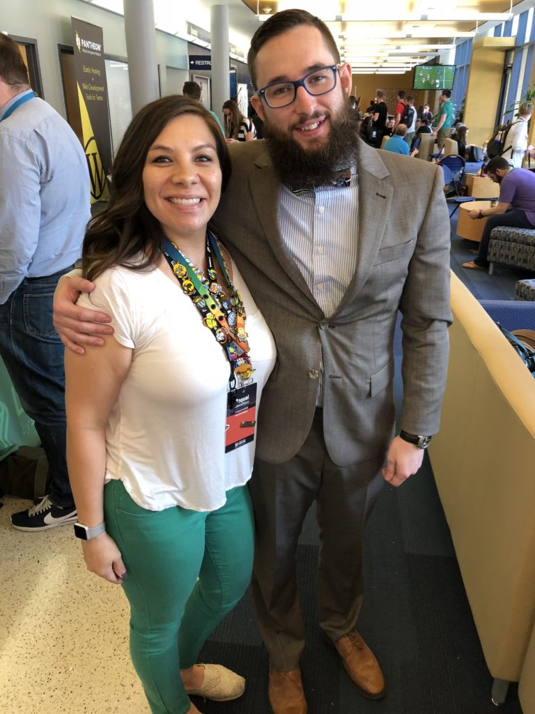Raquel & Andy Wikel standing next to each other as good friends do
